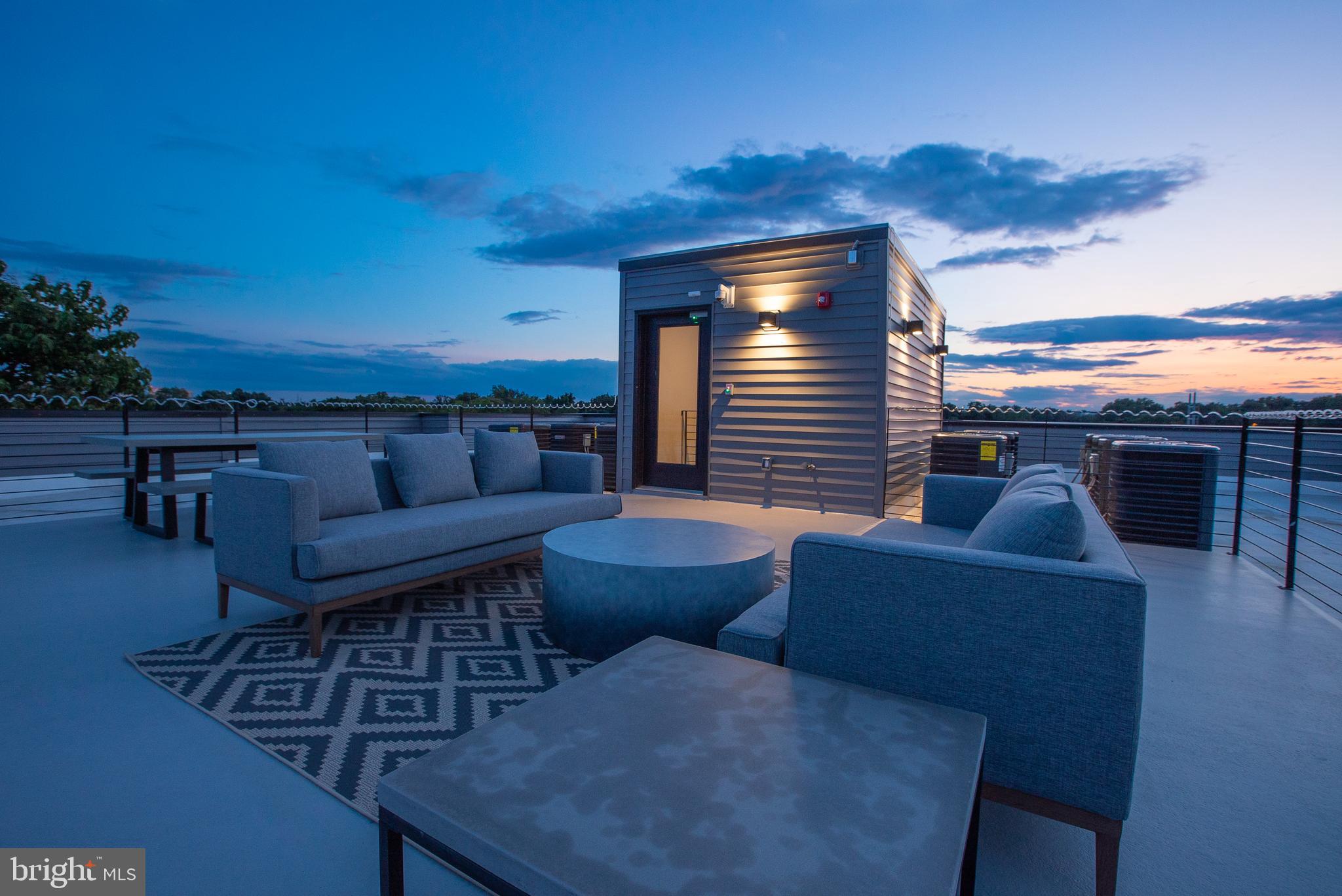 2940 West Thompson Street, Unit 302 Philadelphia, PA 19121 - Photo 14 of 43 a view of a balcony with furniture and a potted plant