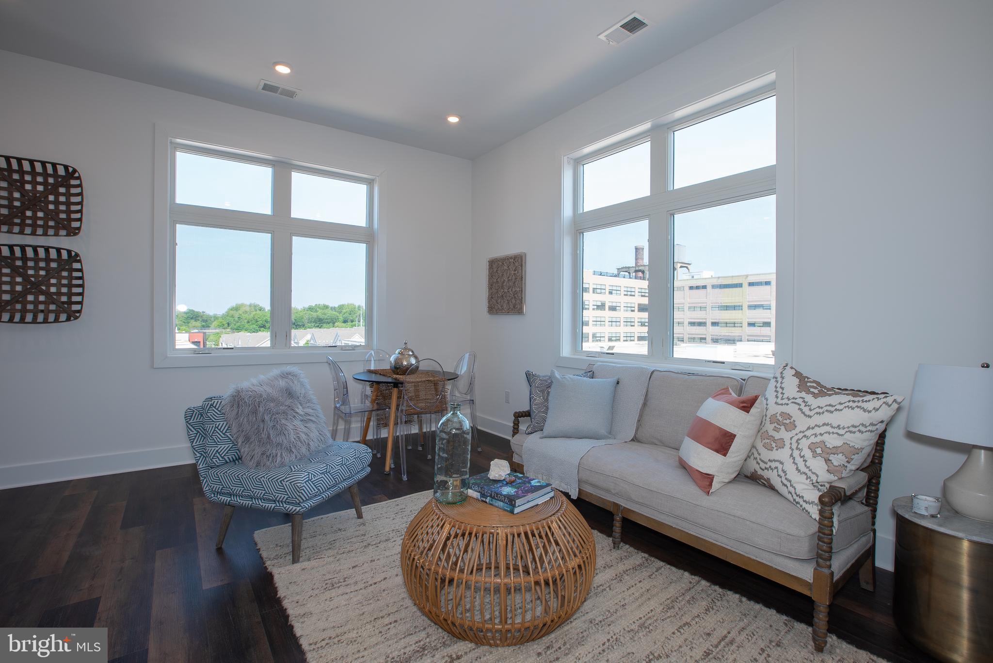 2940 West Thompson Street, Unit 302 Philadelphia, PA 19121 - Photo 22 of 43 a living room with furniture and a window