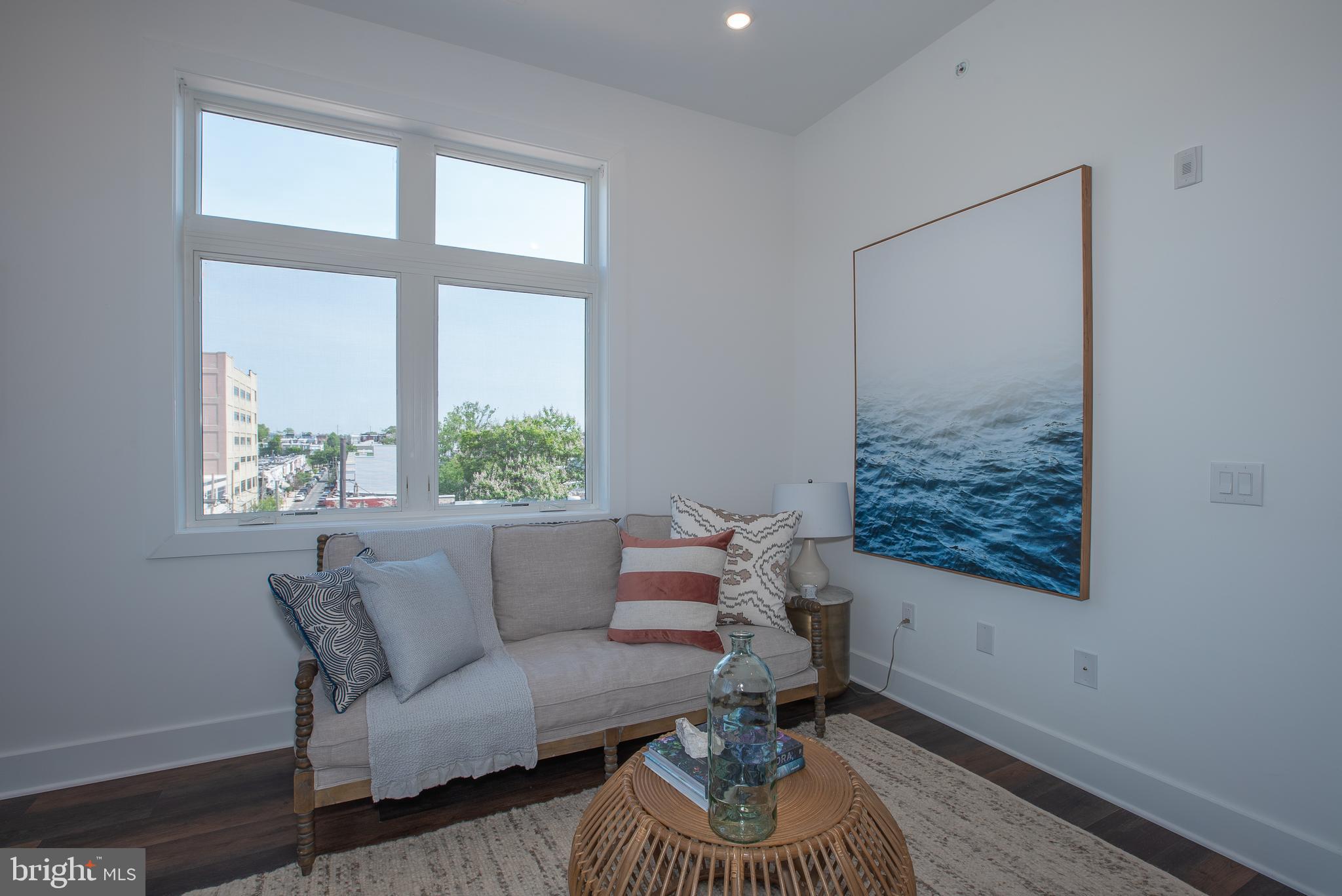2940 West Thompson Street, Unit 302 Philadelphia, PA 19121 - Photo 25 of 43 a living room with furniture and a window