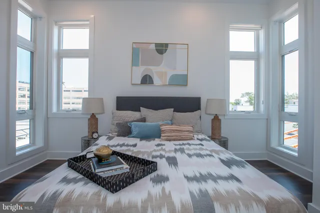 a bedroom with a bed and a couch