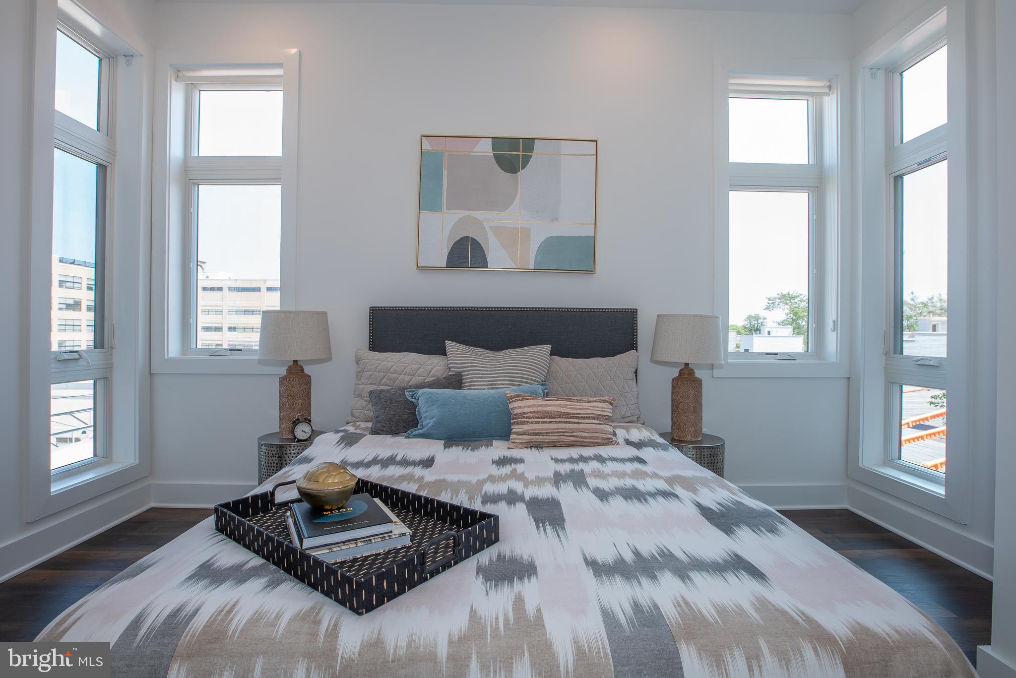 2940 West Thompson Street, Unit 302 Philadelphia, PA 19121 - Photo 34 of 43 a bedroom with a bed and wooden floor