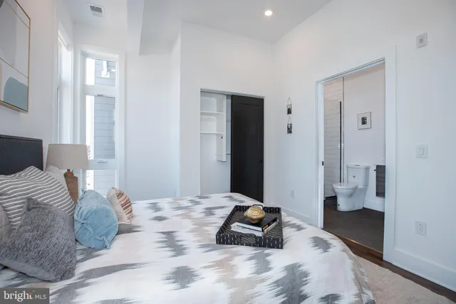 a view of kitchen and dining area with a large window