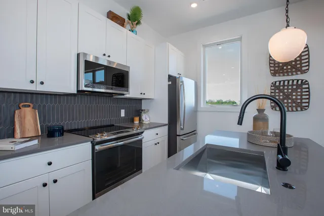 a kitchen with a stove and a sink