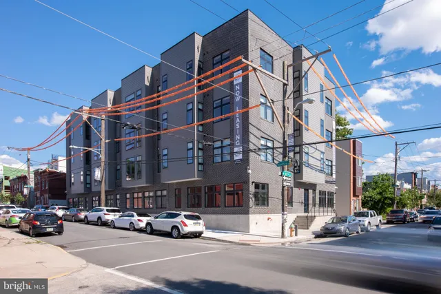 a view of a city street both side of a building