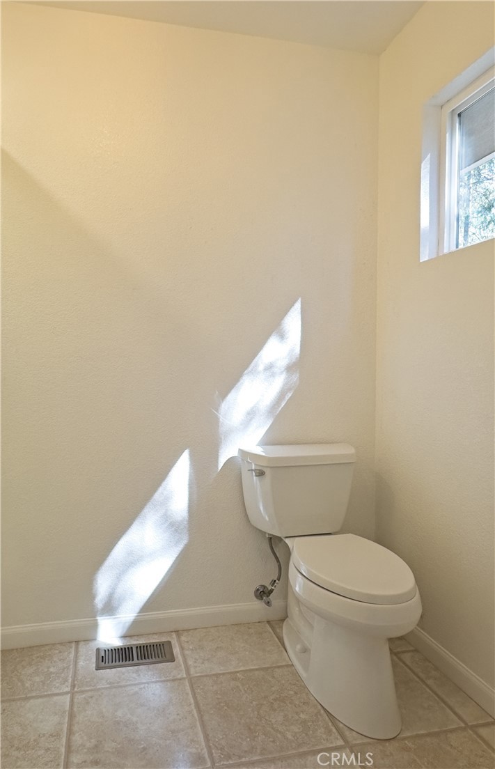 14279 Carnegie Road Magalia, CA 95954 - Photo 20 of 38 a white toilet sitting next to a white sink