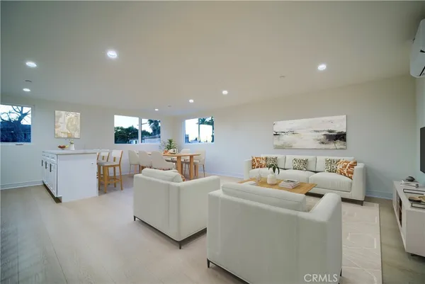 a kitchen with stainless steel appliances a refrigerator sink and stove
