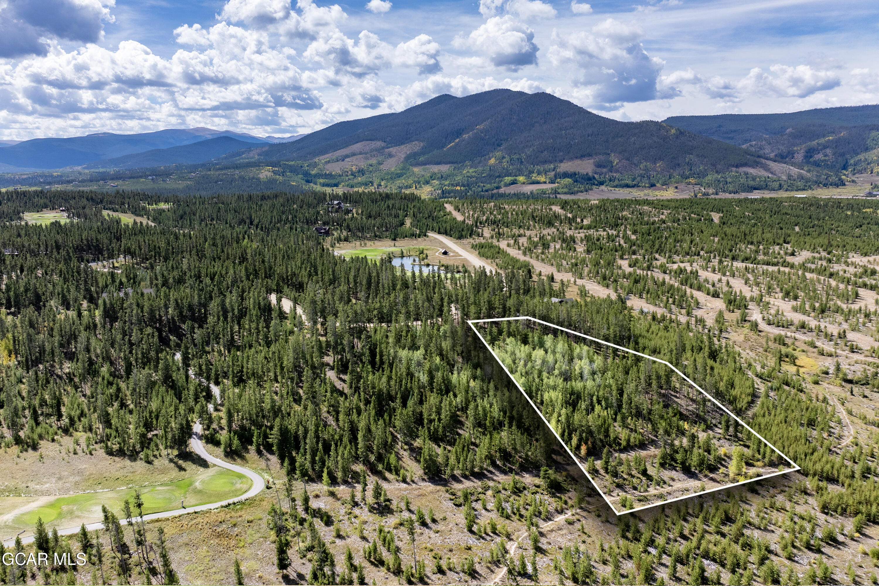 2376 Gcr 511/golf Course Circle Tabernash, CO 80478 - Photo 10 of 14 a view of a city with lush green forest