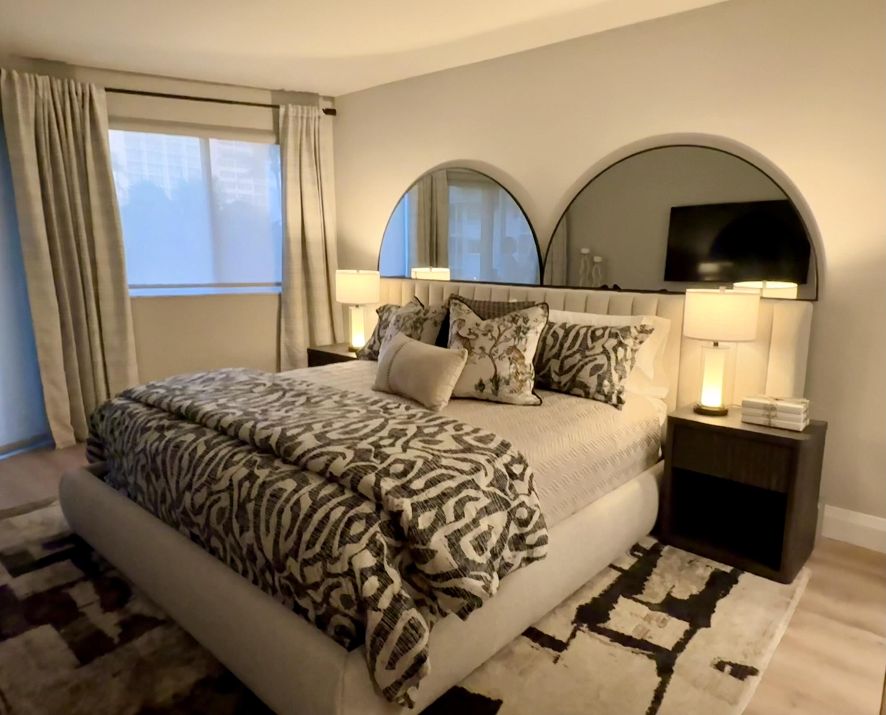 2730 Banyan Road, Unit 23B Boca Raton, FL 33432 - Photo 5 of 5 a bedroom with a bed and wooden floor