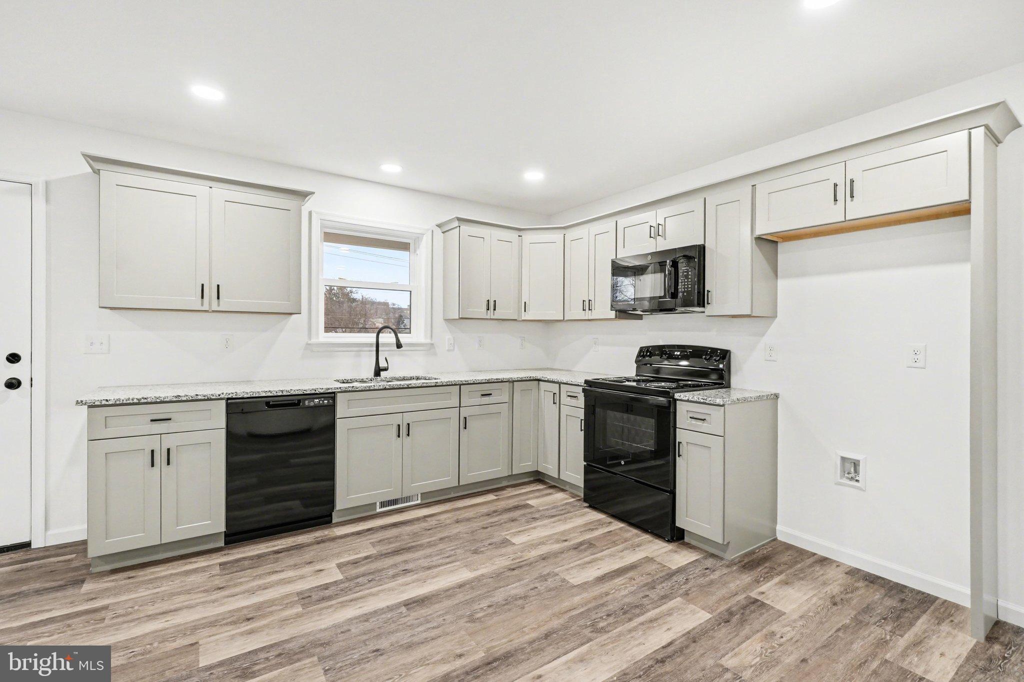418 Elm Street Lebanon, PA 17042 - Photo 11 of 43 Modern kitchen with sleek cabinetry.