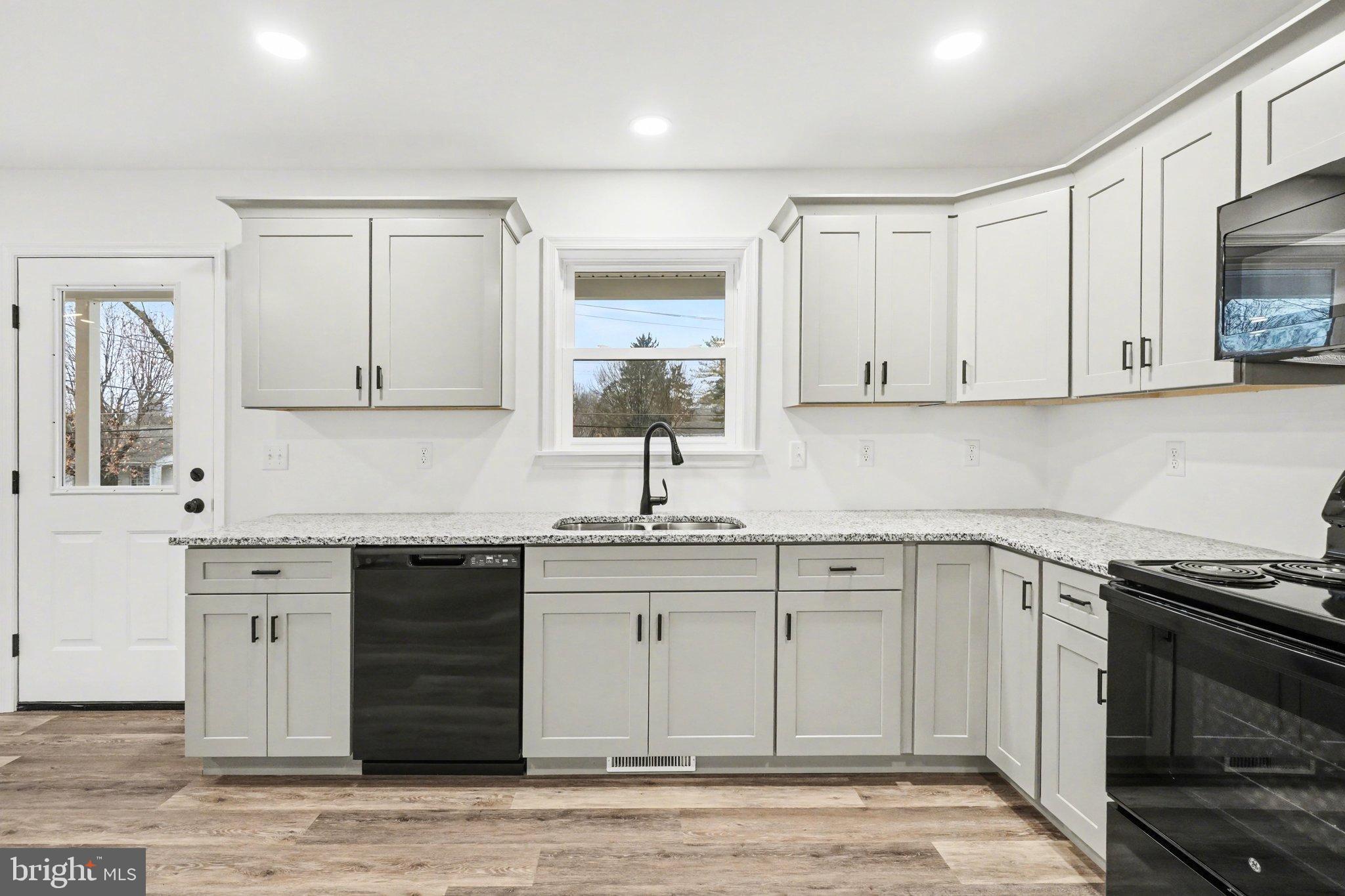 418 Elm Street Lebanon, PA 17042 - Photo 12 of 43 Modern kitchen with sleek cabinetry and light.