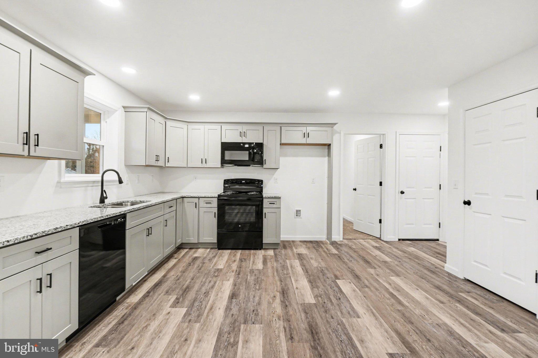 418 Elm Street Lebanon, PA 17042 - Photo 10 of 43 Modern kitchen with sleek cabinetry and flooring.