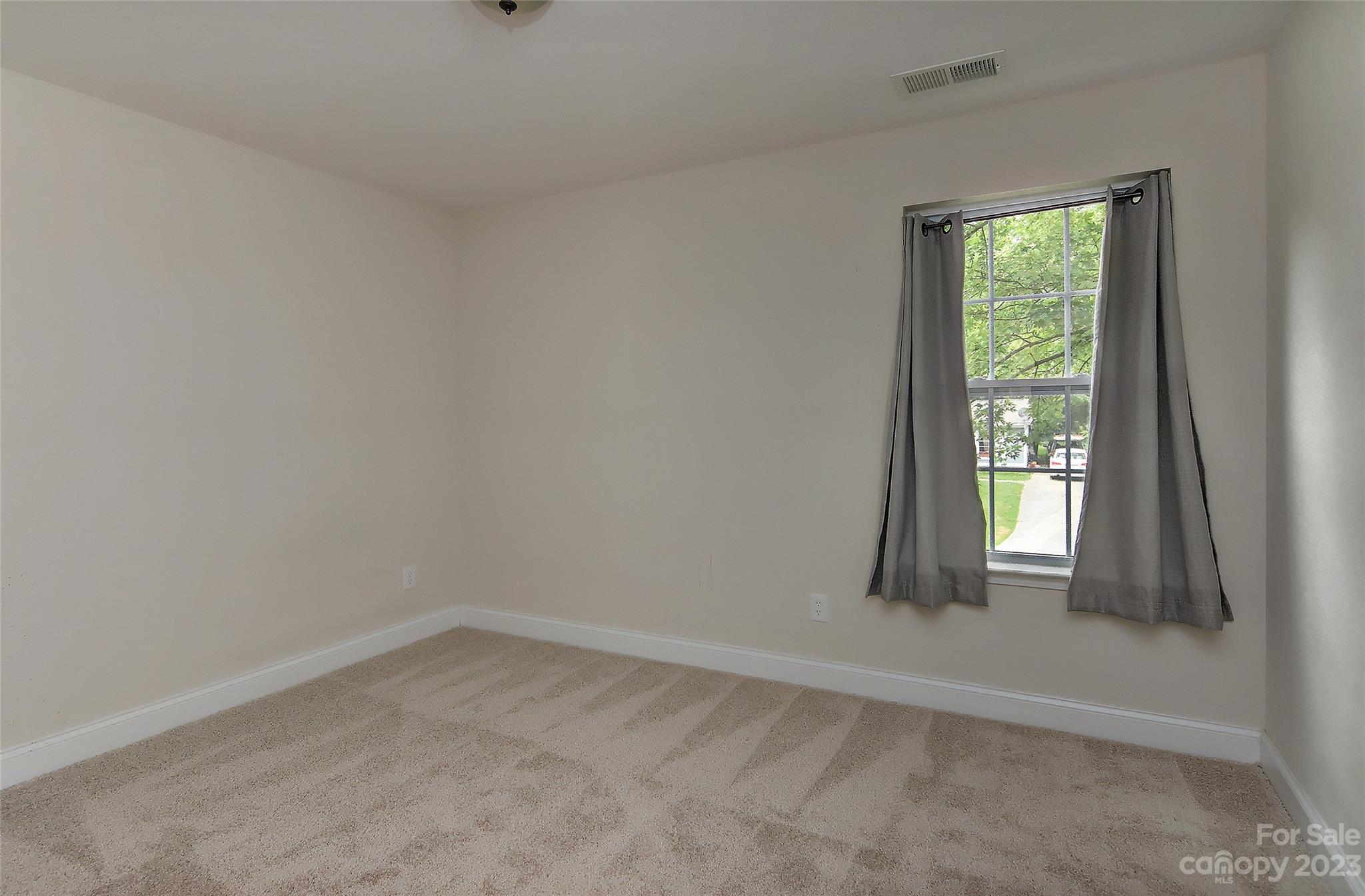 6413 McBride Street Charlotte, NC 28215 - Photo 13 of 21 an empty room with windows
