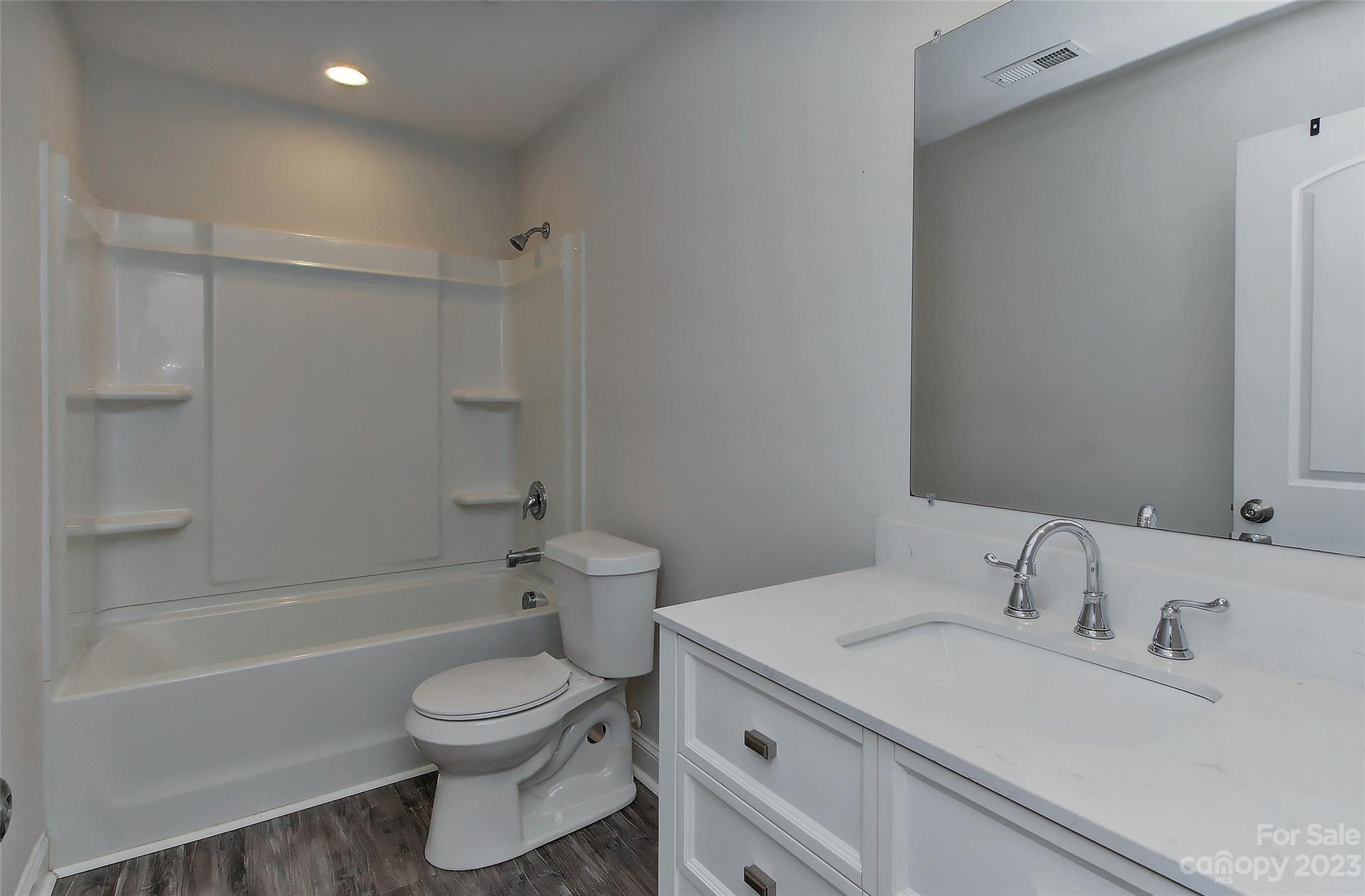 6413 McBride Street Charlotte, NC 28215 - Photo 14 of 21 a bathroom with a sink toilet and shower