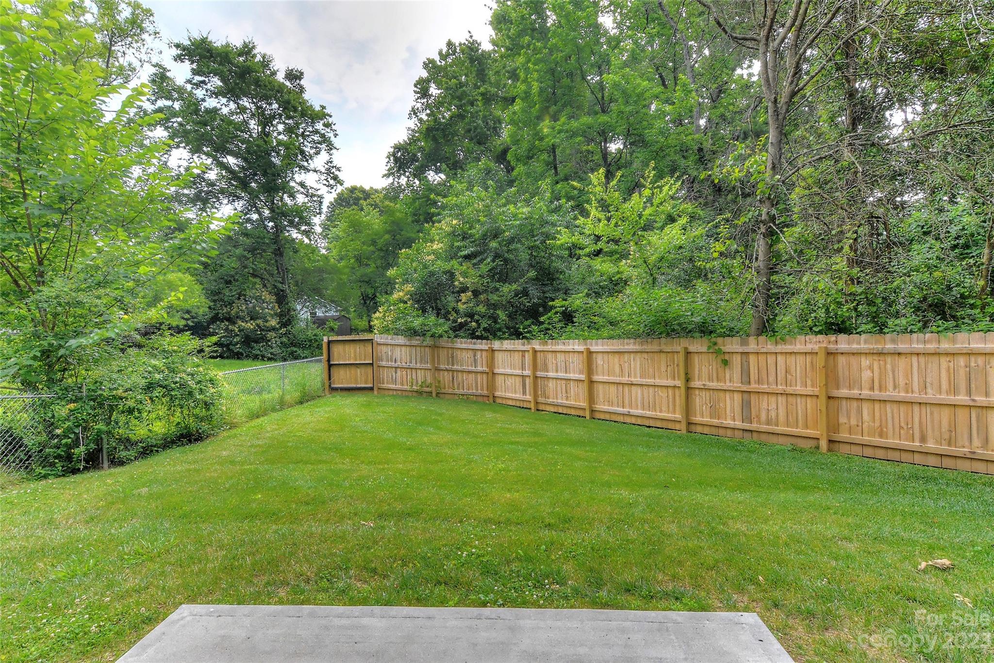 6413 McBride Street Charlotte, NC 28215 - Photo 20 of 21 a view of a backyard with a small cabin