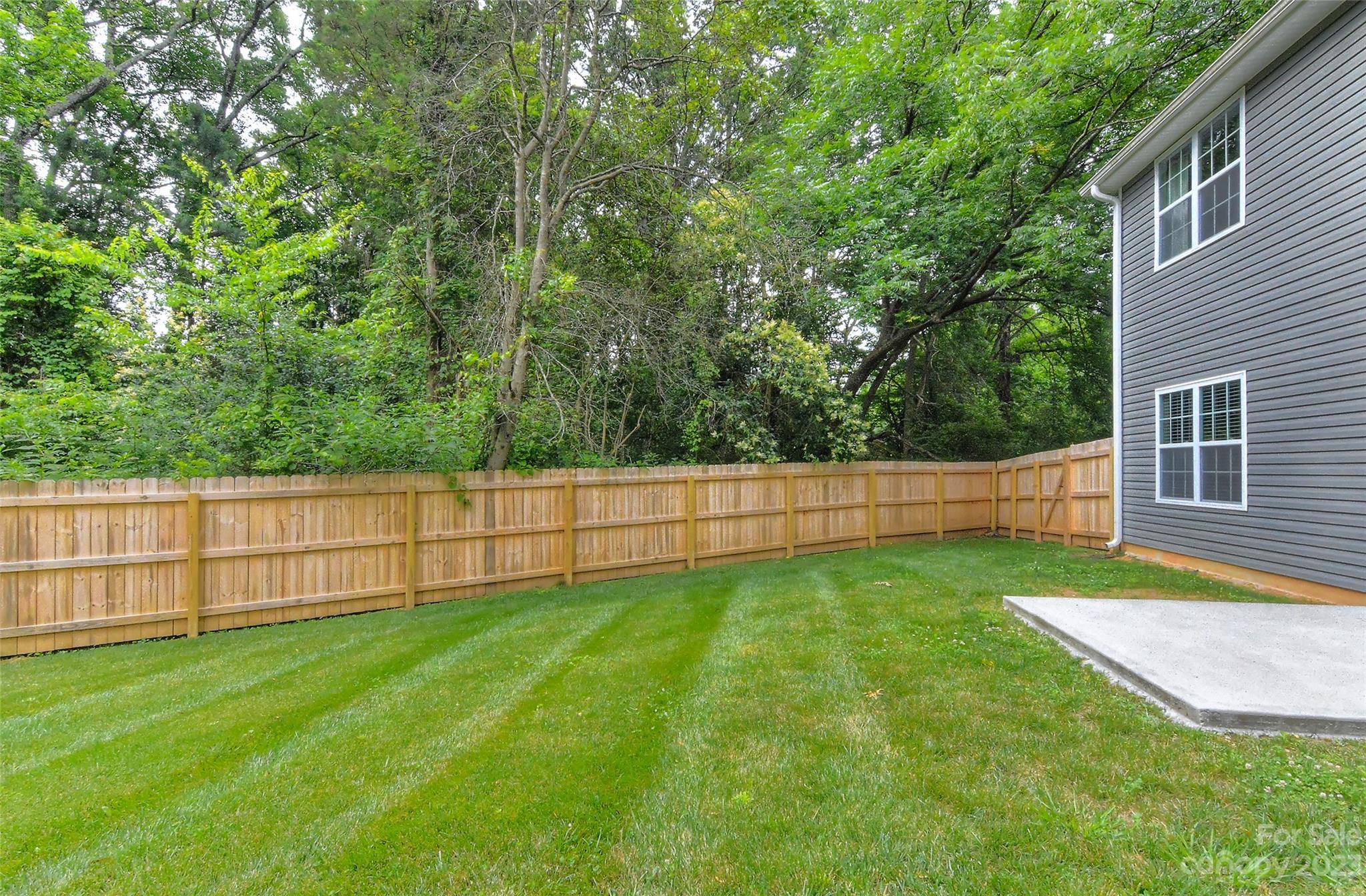 6413 McBride Street Charlotte, NC 28215 - Photo 21 of 21 a view of a backyard with a small cabin