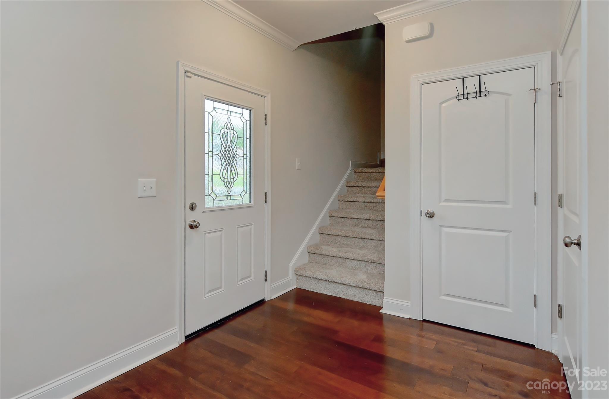 6413 McBride Street Charlotte, NC 28215 - Photo 9 of 21 a view of a hallway with wooden floor and entryway