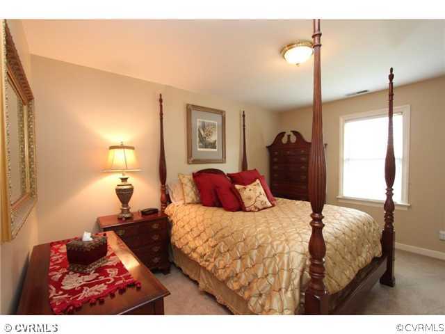 8206 Spring Meadow Road North Chesterfield, VA 23235 - Photo 20 of 24 a bedroom with a bed and a night stand