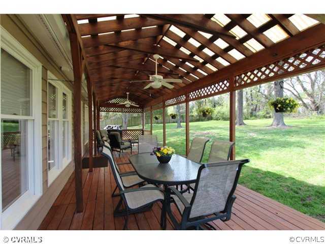 8206 Spring Meadow Road North Chesterfield, VA 23235 - Photo 24 of 24 a view of a patio with a table chairs and a backyard