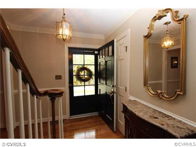 8206 Spring Meadow Road North Chesterfield, VA 23235 - Photo 5 of 24 a bathroom with a sink a mirror and a shower