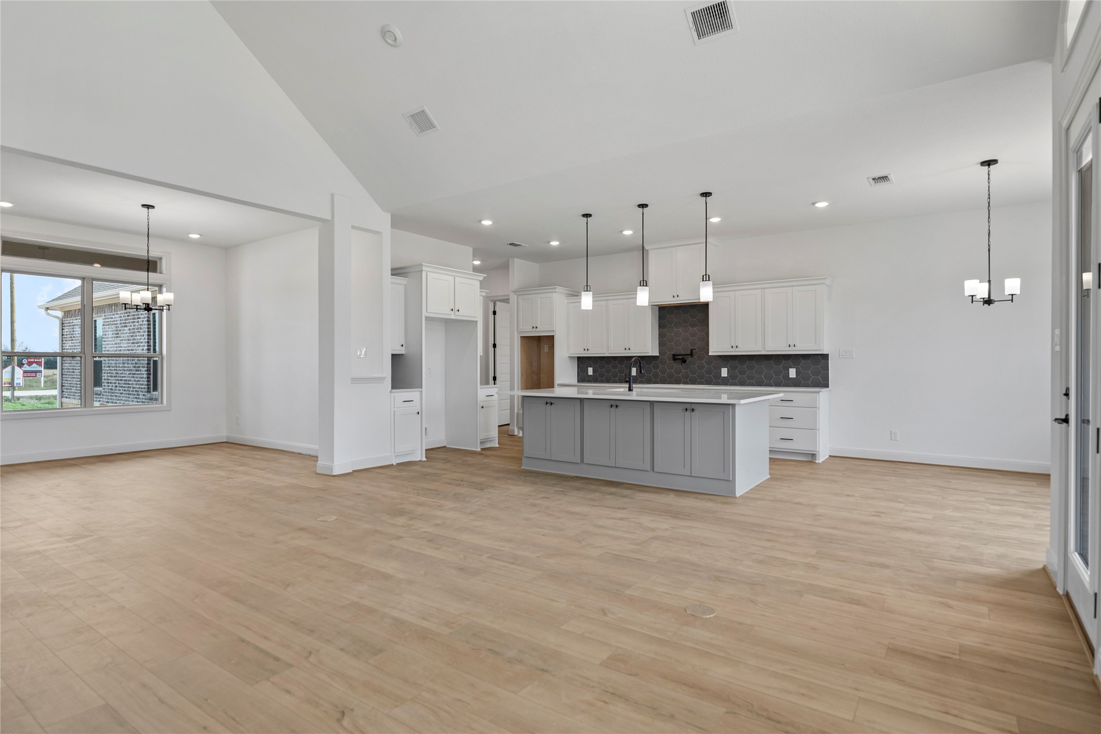 1819 Rymal Ranch Road Alvin, TX 77511 - Photo 14 of 17 a view of kitchen with kitchen island white cabinets and stainless steel appliances