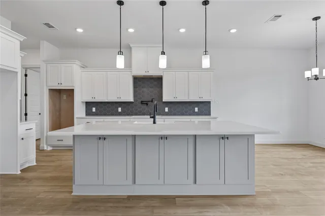 a view of kitchen with stainless steel appliances sink refrigerator and microwave