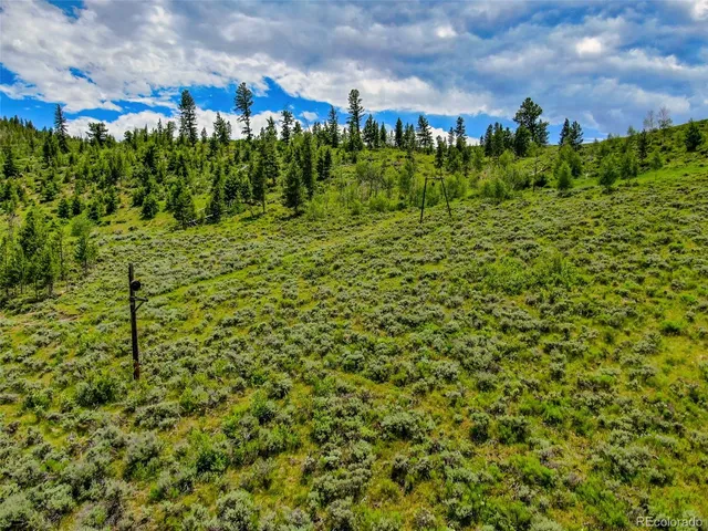 a view of a city with mountains in the background