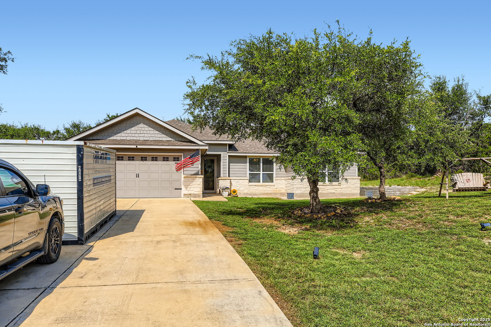 1041 Madrone Road Fischer, TX 78623 - Photo 1 of 29 a front view of a house with a yard and garage