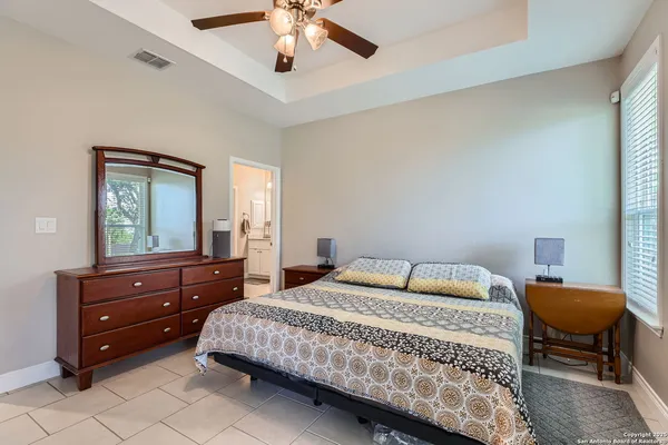 a bedroom with a bed and chair