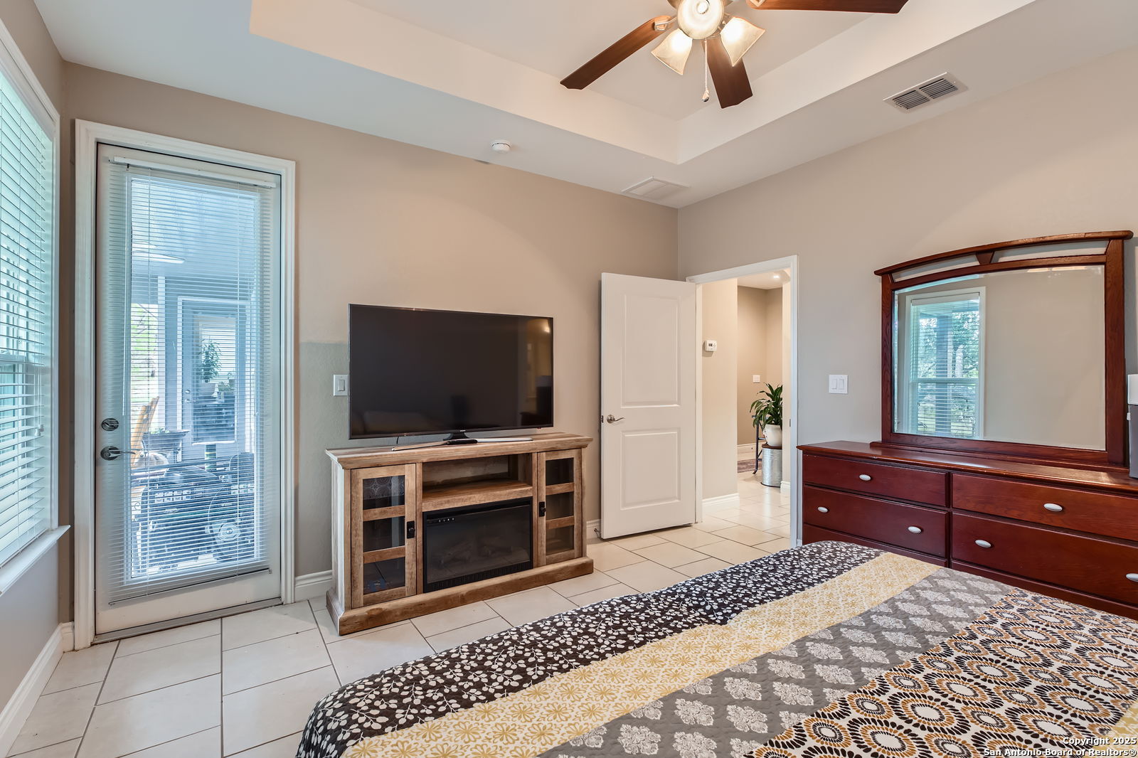 1041 Madrone Road Fischer, TX 78623 - Photo 16 of 29 a hotel room with a bed and a flat screen television
