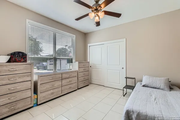 a room with a bed and a chandelier
