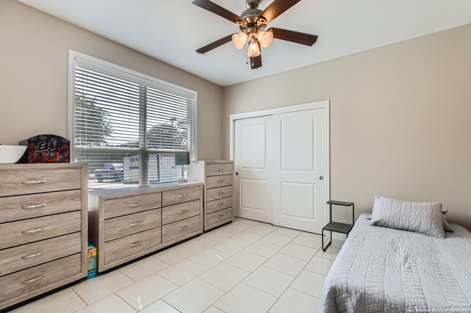 1041 Madrone Road Fischer, TX 78623 - Photo 20 of 29 a room with a bed and a chandelier