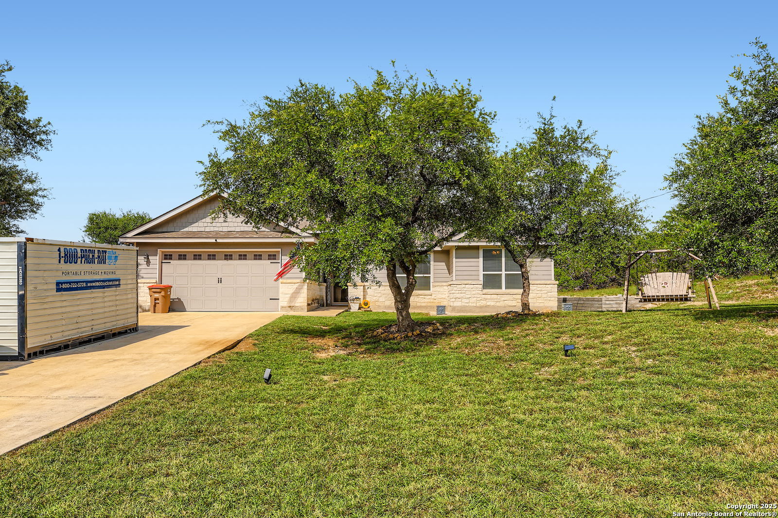 1041 Madrone Road Fischer, TX 78623 - Photo 2 of 29 a front view of a house with a yard and trees