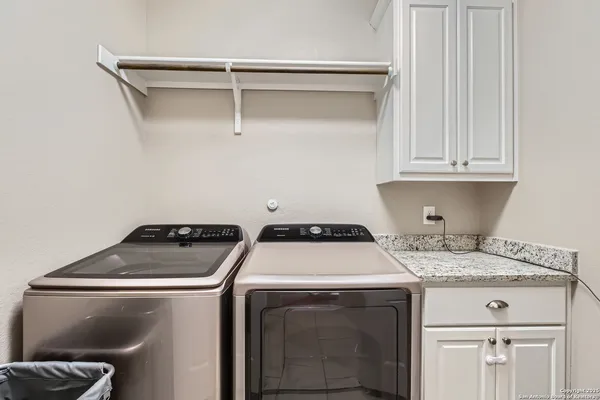 a utility room with dryer and washer