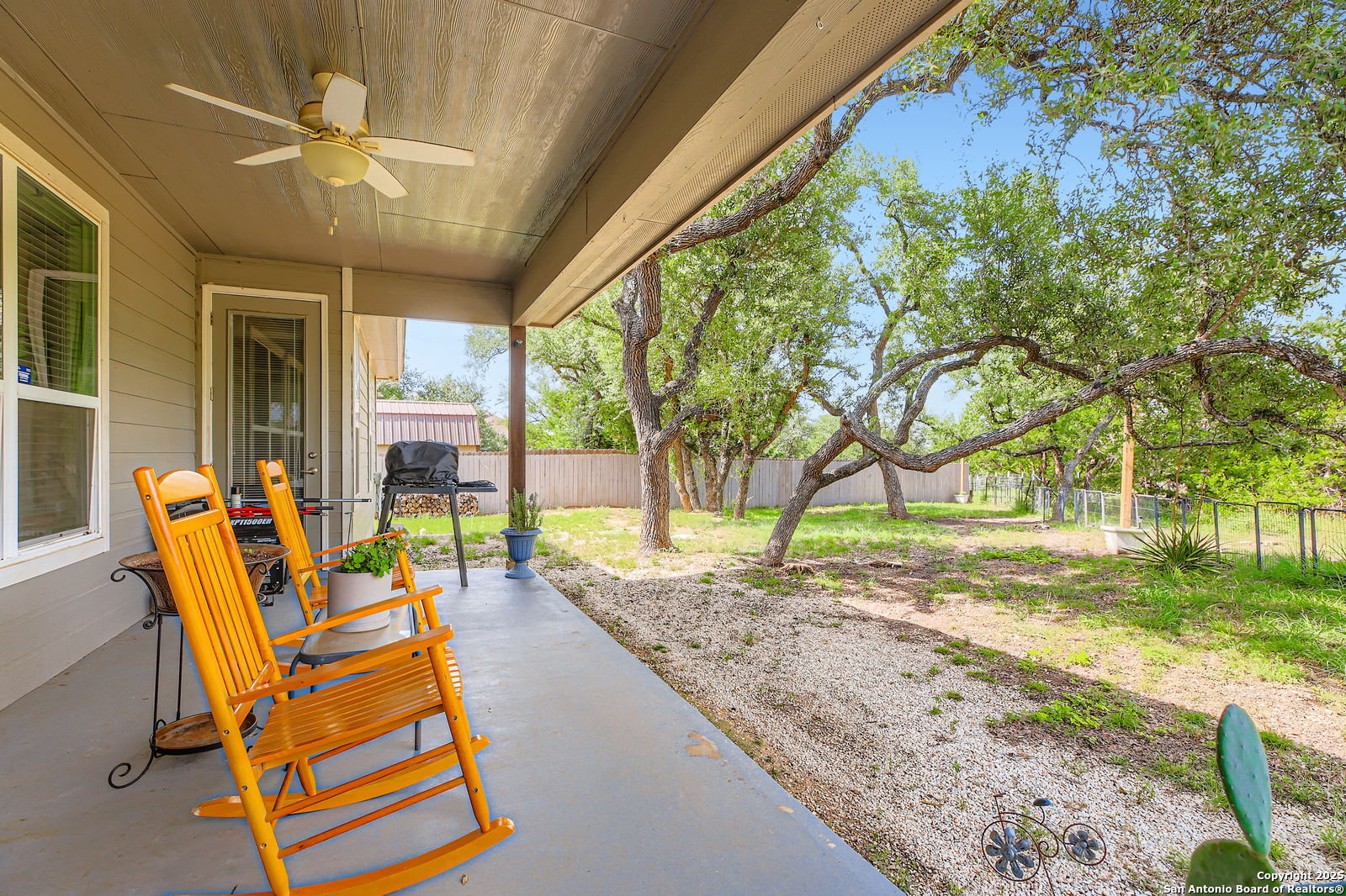 1041 Madrone Road Fischer, TX 78623 - Photo 24 of 29 a view of a backyard with table and chairs