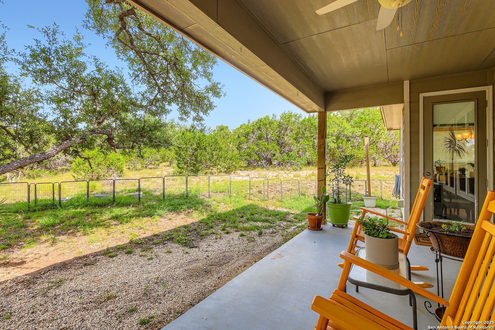 1041 Madrone Road Fischer, TX 78623 - Photo 25 of 29 a view of a room with wooden floor and outdoor seating