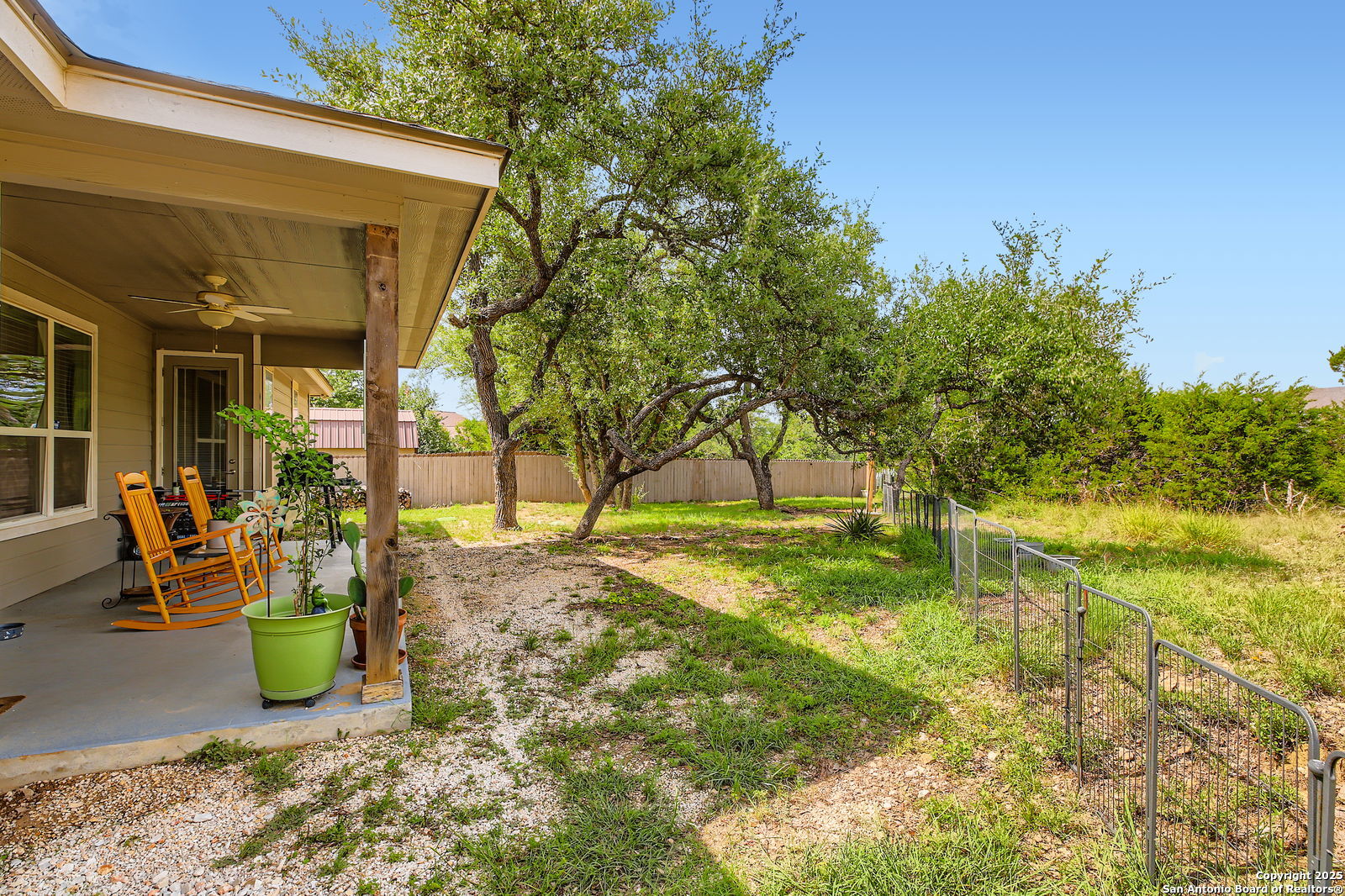 1041 Madrone Road Fischer, TX 78623 - Photo 26 of 29 a view of a yard with plants and a slide