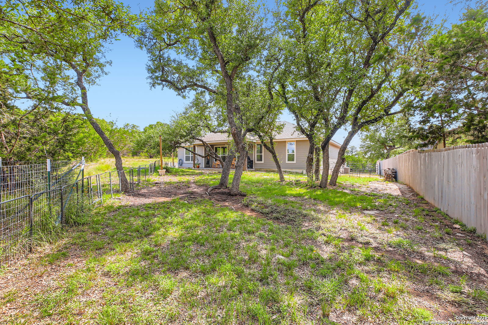 1041 Madrone Road Fischer, TX 78623 - Photo 27 of 29 a view of backyard with tree