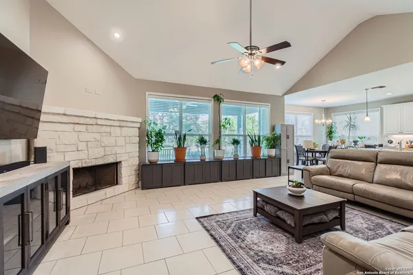 a living room with furniture and a fireplace