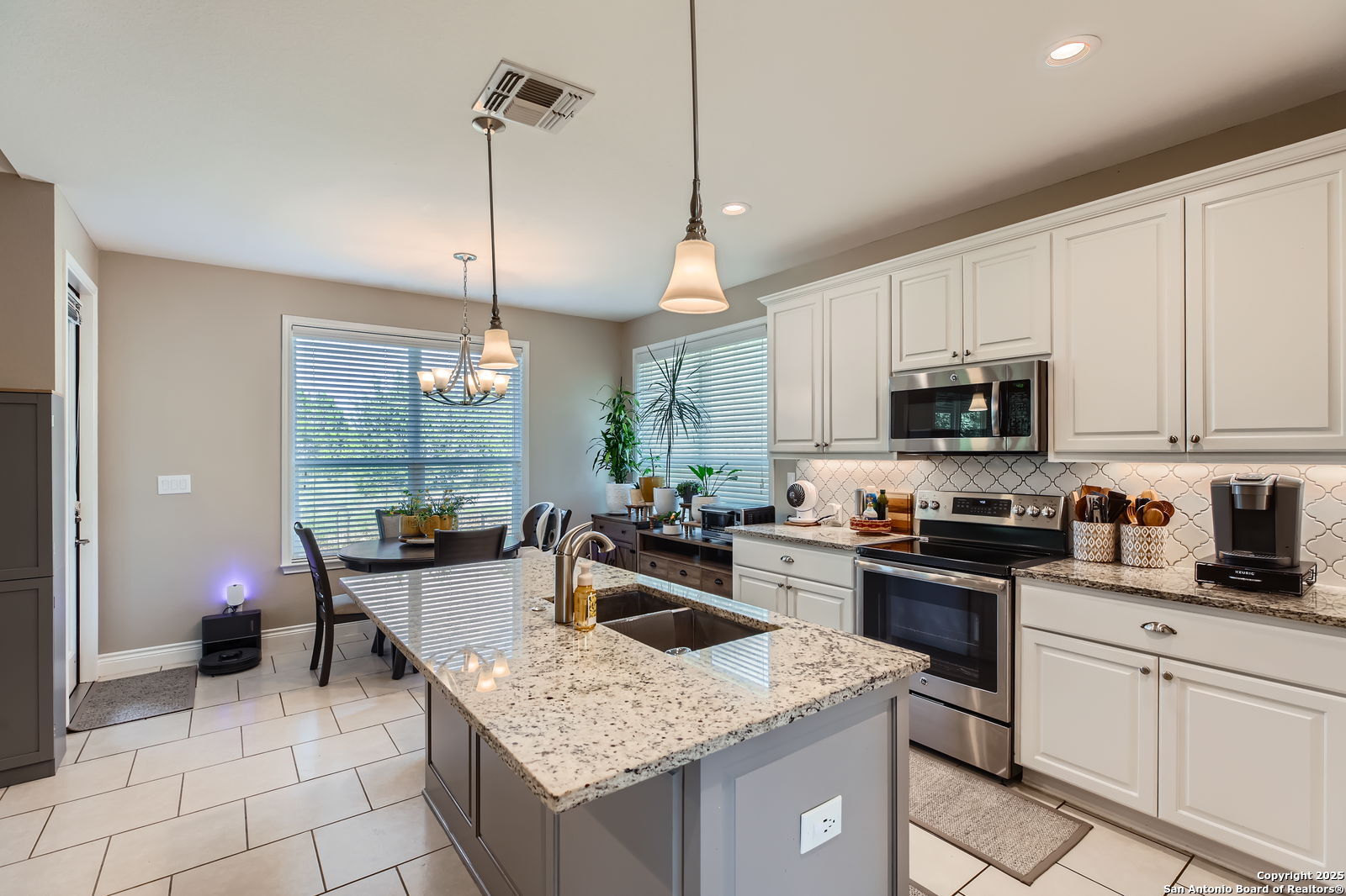 1041 Madrone Road Fischer, TX 78623 - Photo 10 of 29 a kitchen with granite countertop a sink a counter top space appliances and cabinets