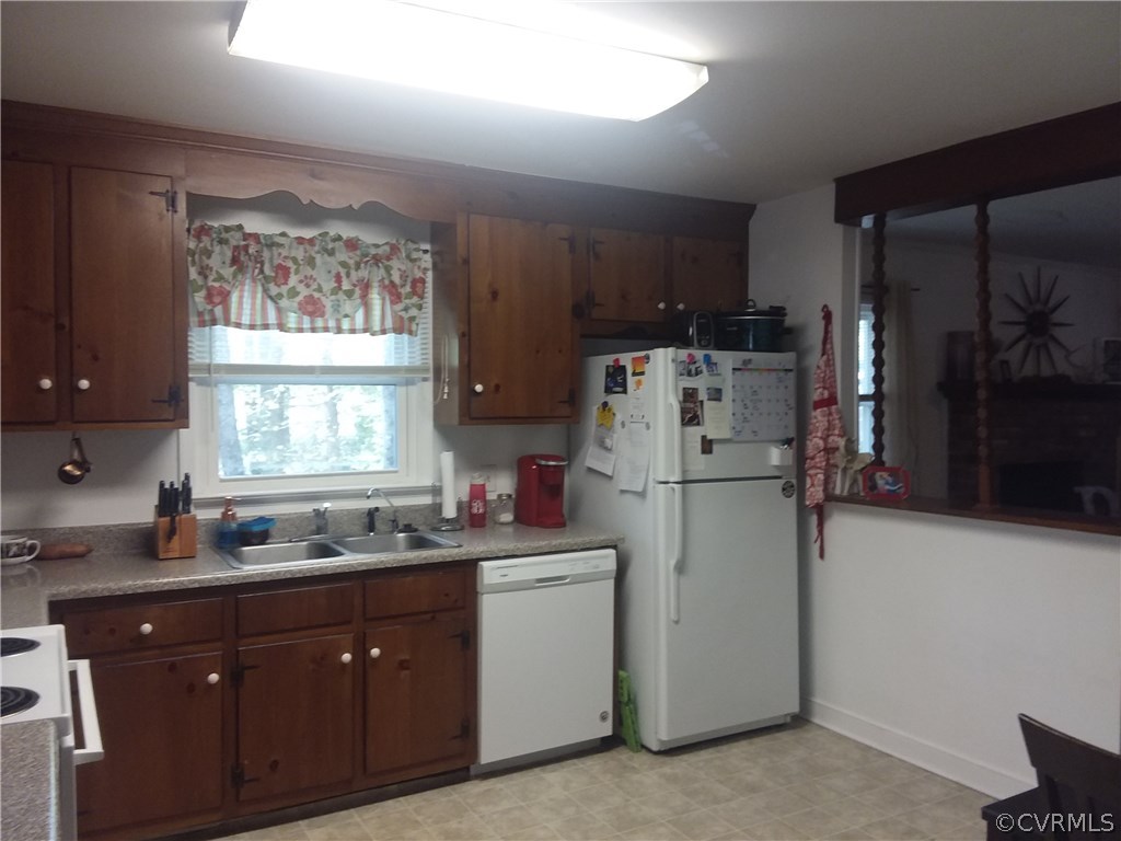 3932 Bronholly Road Chesterfield, VA 23832 - Photo 8 of 17 a kitchen with a sink a refrigerator and window