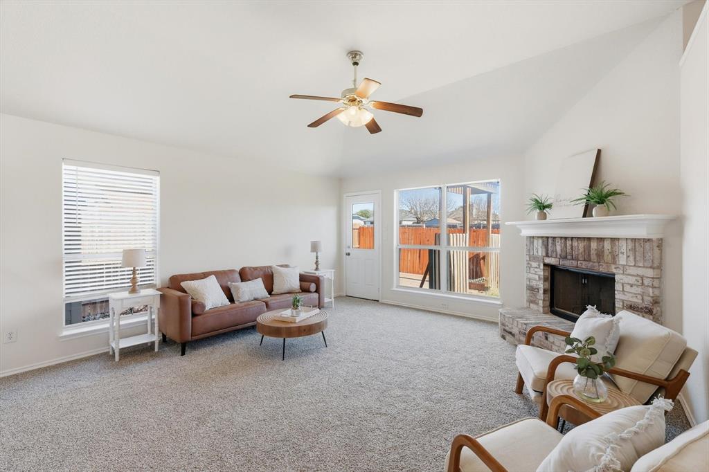 121 Kings Way Drive Rhome, TX 76078 - Photo 19 of 38 a living room with furniture and a fireplace