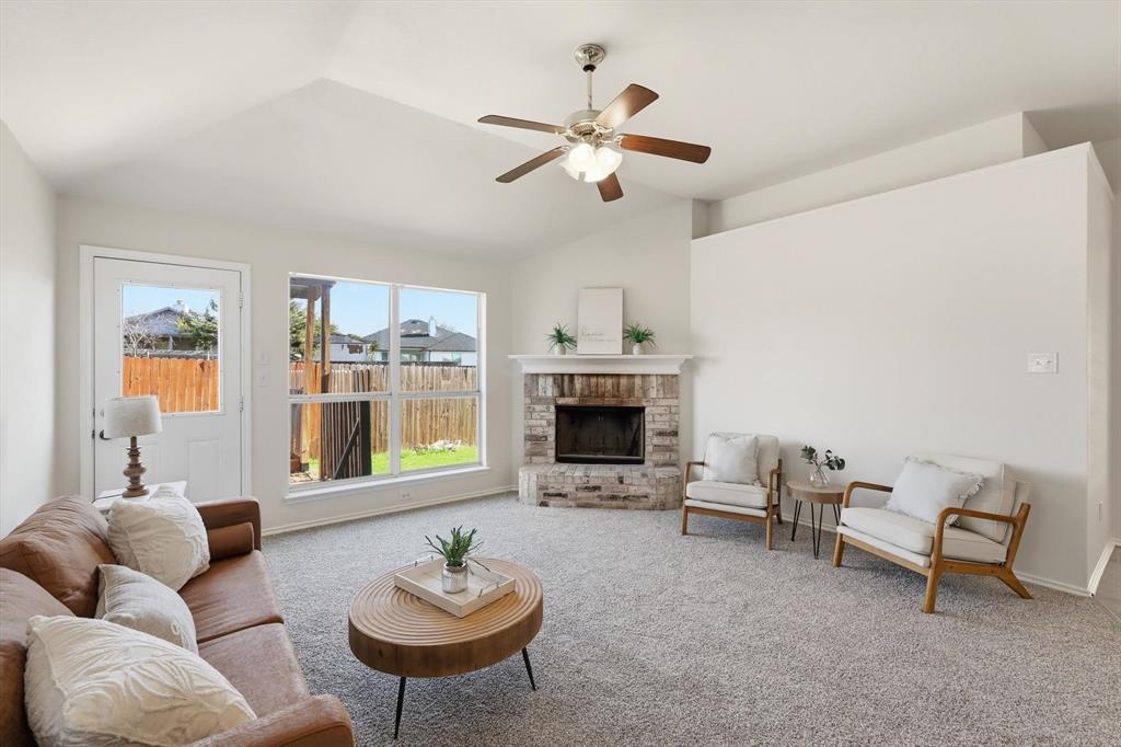 121 Kings Way Drive Rhome, TX 76078 - Photo 20 of 38 a living room with furniture and a fireplace