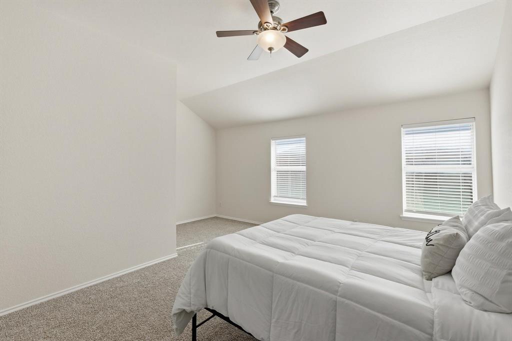 121 Kings Way Drive Rhome, TX 76078 - Photo 23 of 38 a bedroom with a bed and a window