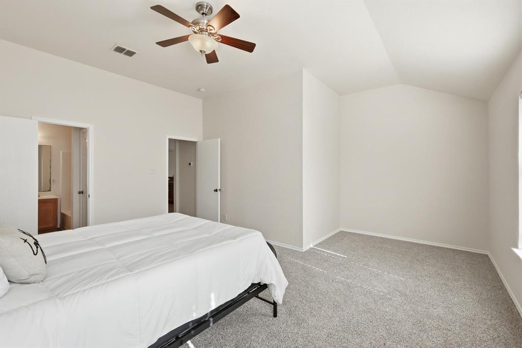 121 Kings Way Drive Rhome, TX 76078 - Photo 24 of 38 a bedroom with a bed and a ceiling fan