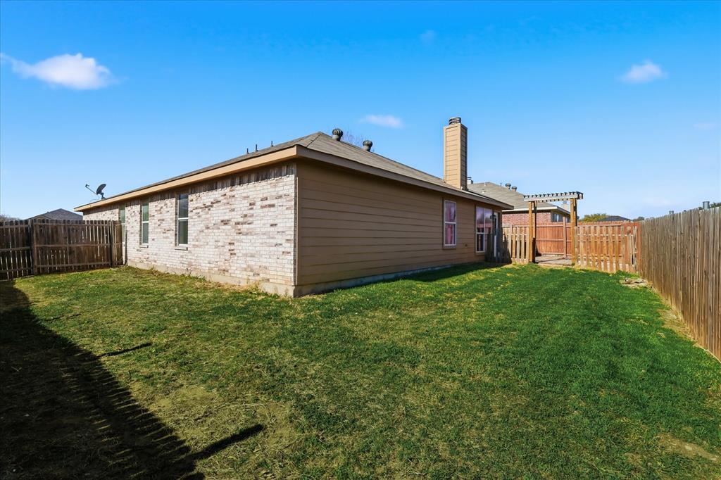 121 Kings Way Drive Rhome, TX 76078 - Photo 38 of 38 a view of a backyard with a garden