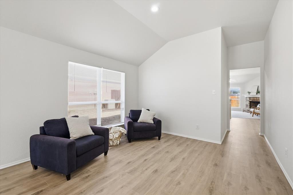 121 Kings Way Drive Rhome, TX 76078 - Photo 7 of 38 a living room with furniture and a large window