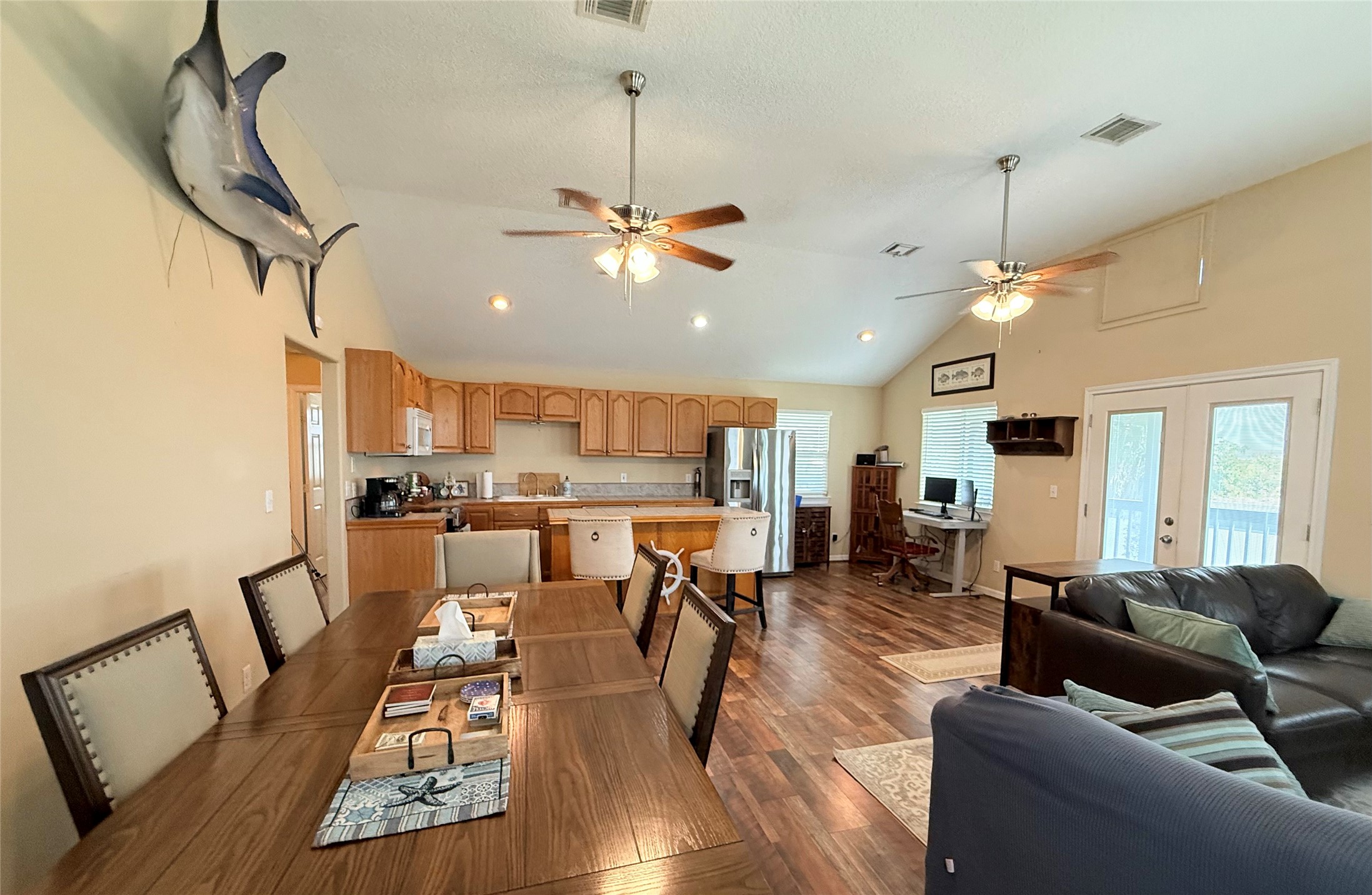 163 County Road 299 Sargent, TX 77414 - Photo 28 of 38 a living room with furniture kitchen view and a wooden floor