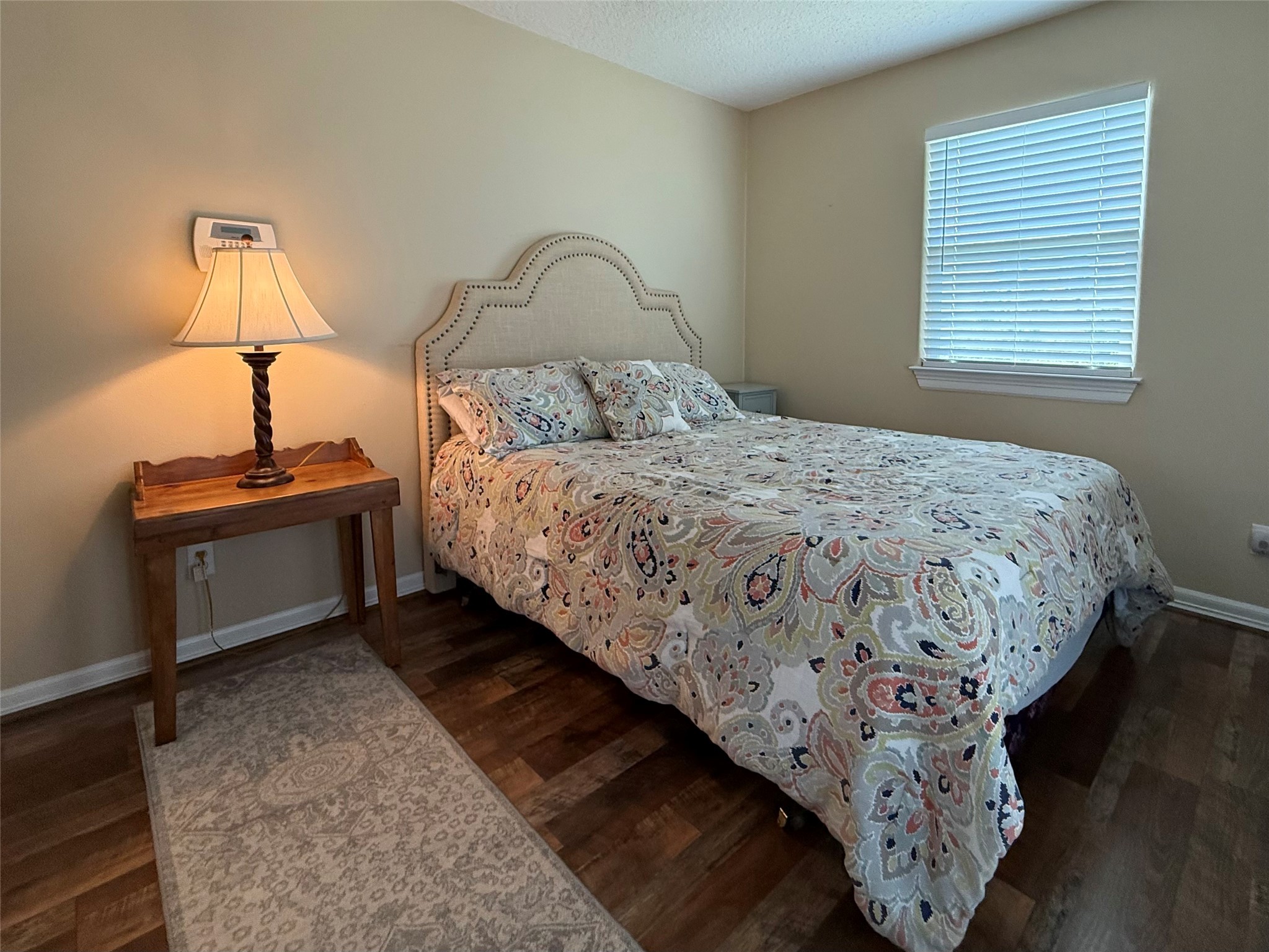 163 County Road 299 Sargent, TX 77414 - Photo 30 of 38 a bedroom with a bed and a night stand