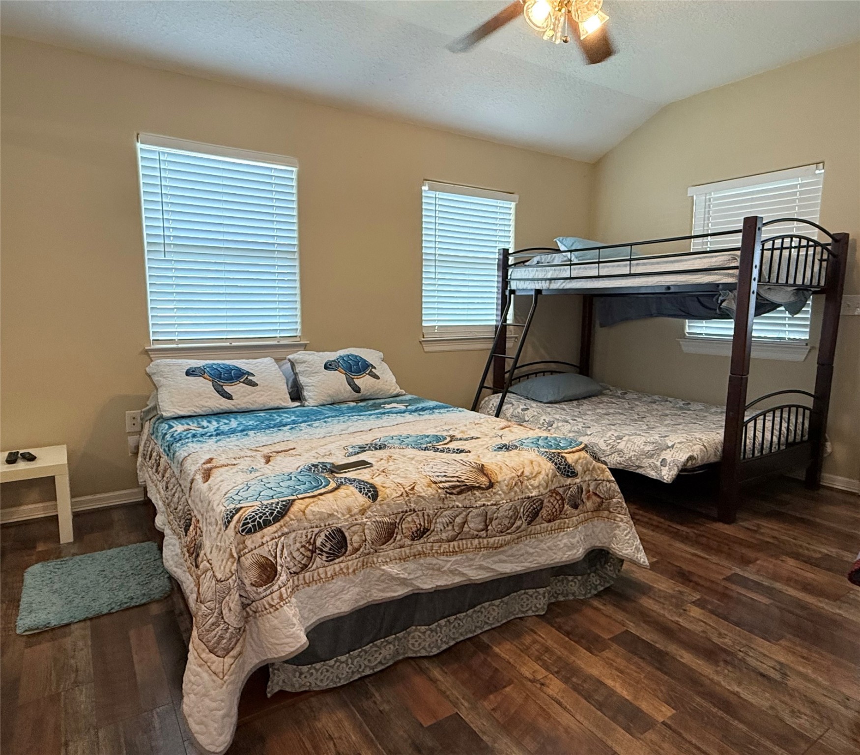 163 County Road 299 Sargent, TX 77414 - Photo 33 of 38 a bedroom with a bed and a chandelier