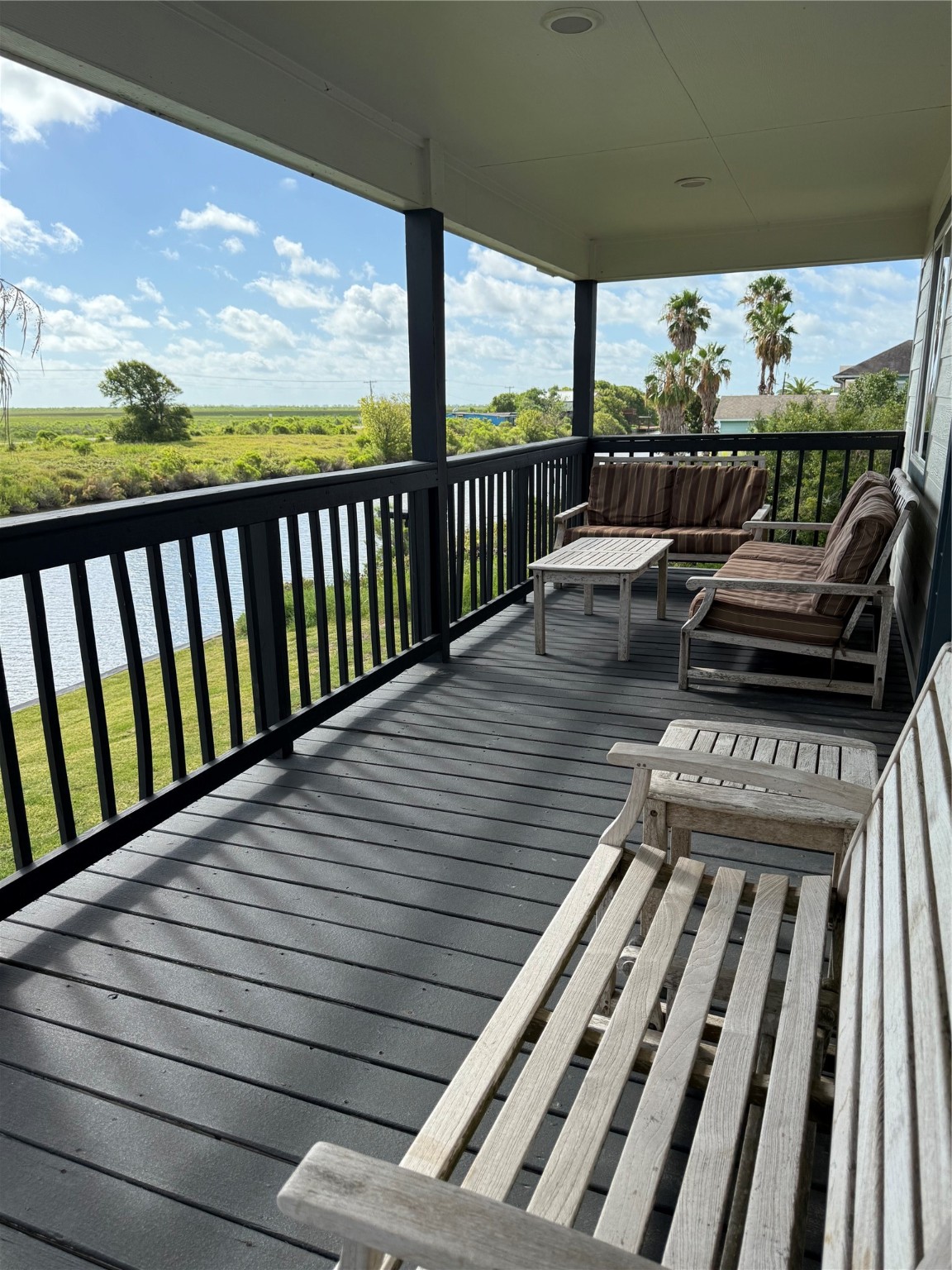 163 County Road 299 Sargent, TX 77414 - Photo 36 of 38 a view of a balcony with wooden floor